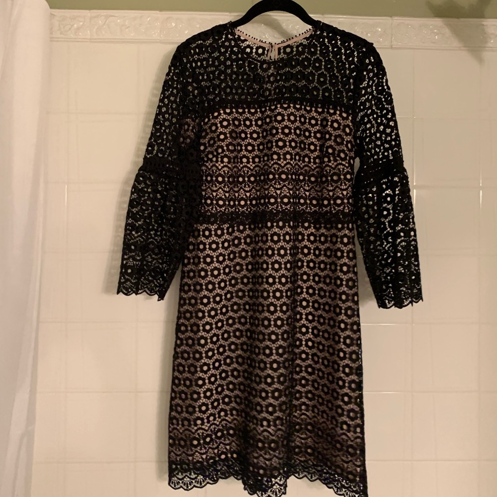 J. Crew black lace dress with bell sleeves.